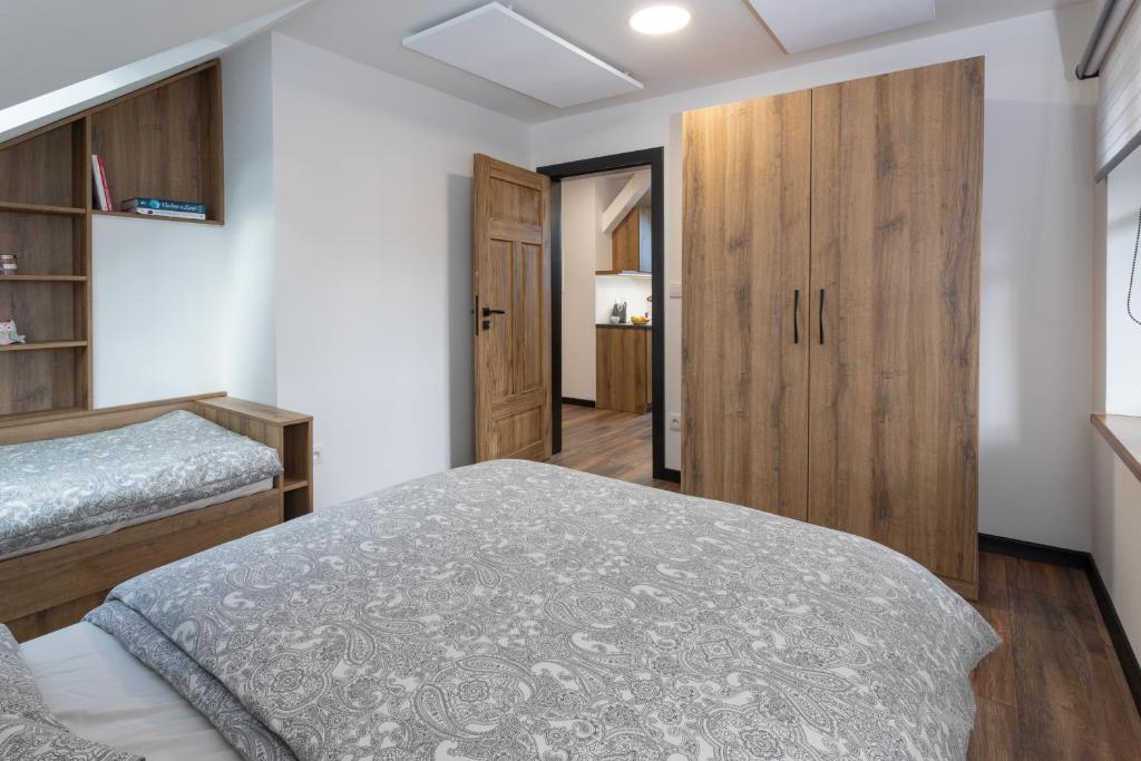 Postel nebo postele na pokoji v ubytování Vila Máchovka