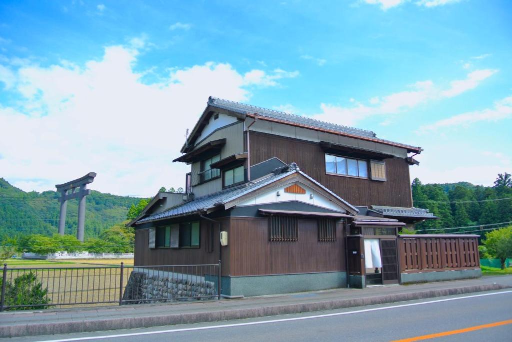 a small building on the side of a street at Villa KUMANO in Hongu