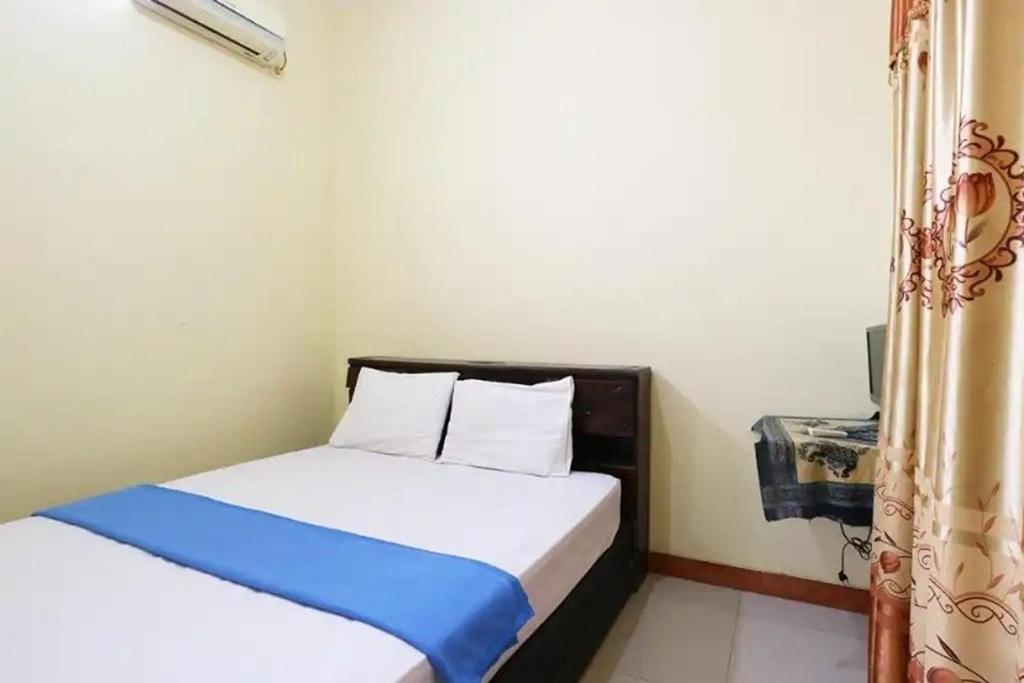 Postel nebo postele na pokoji v ubytování Hotel Serasi 2