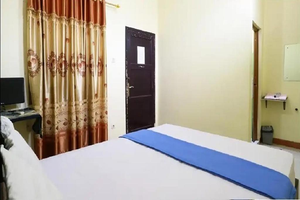 Postel nebo postele na pokoji v ubytování Hotel Serasi 2