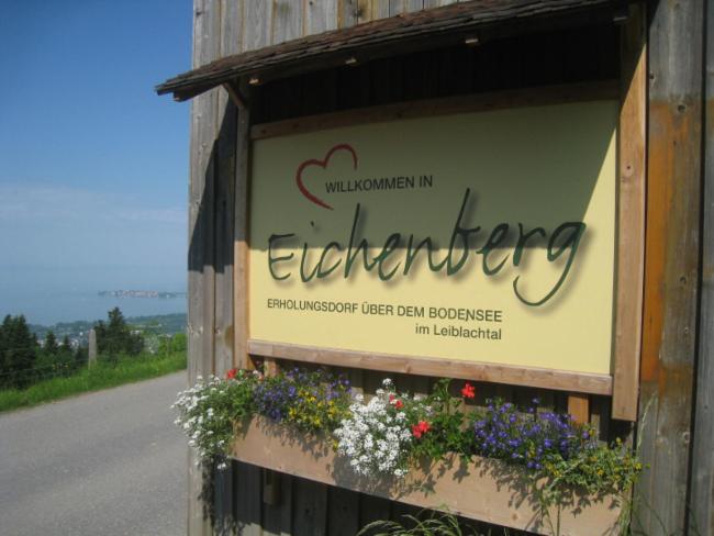 a sign for the entrance to an enchantingruck fresh rental database at Dorf 70 in Eichenberg