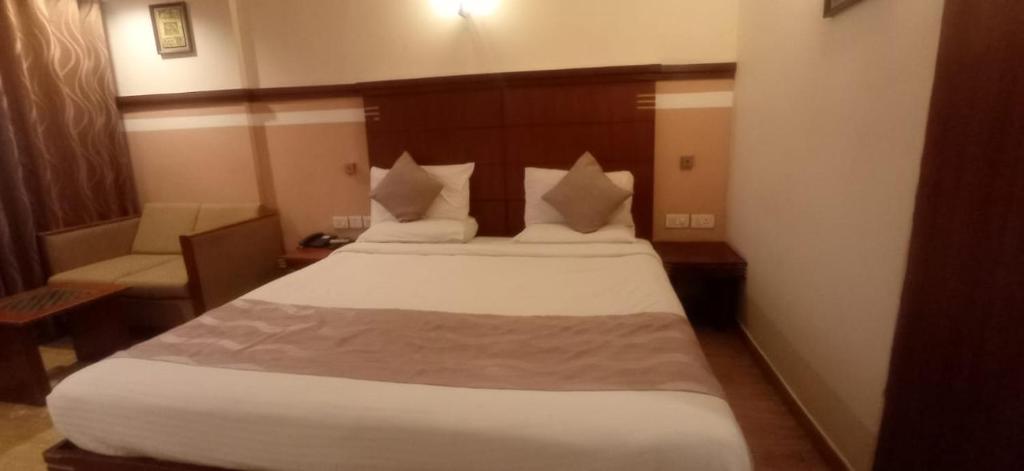 Postel nebo postele na pokoji v ubytování Rain Drops Hotel