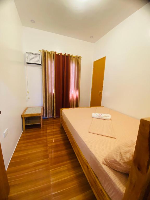 Postel nebo postele na pokoji v ubytování Lucas Transient House