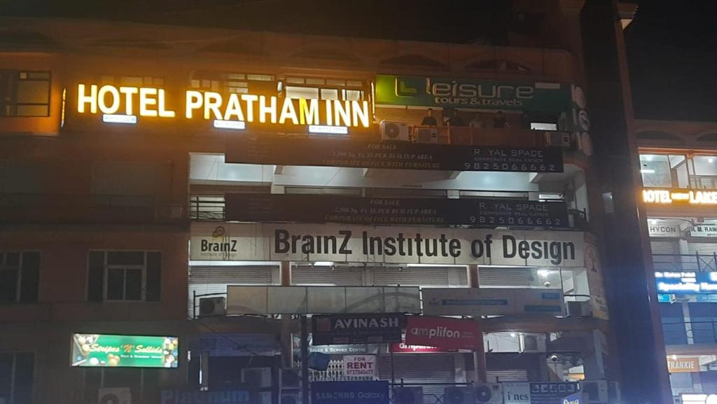 a building with a sign that reads hotel plantationlining at Hotel Pratham Inn in Ahmedabad