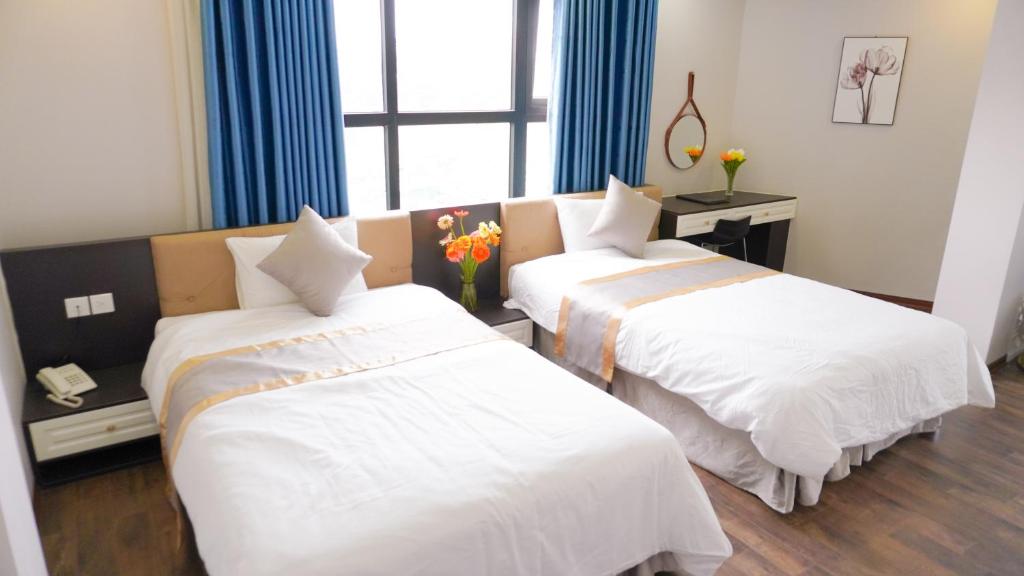 Postel nebo postele na pokoji v ubytování HK HOTEL Trung Kính