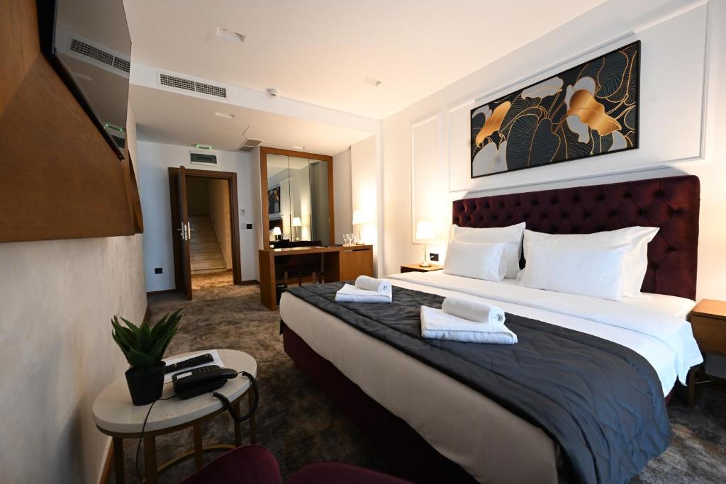 Postel nebo postele na pokoji v ubytování Hotel Tamiš & Spa