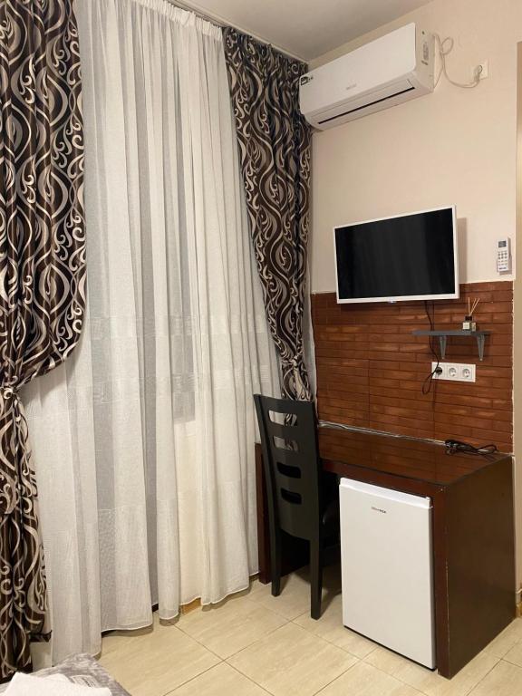 TV a/nebo společenská místnost v ubytování Siqvaruli