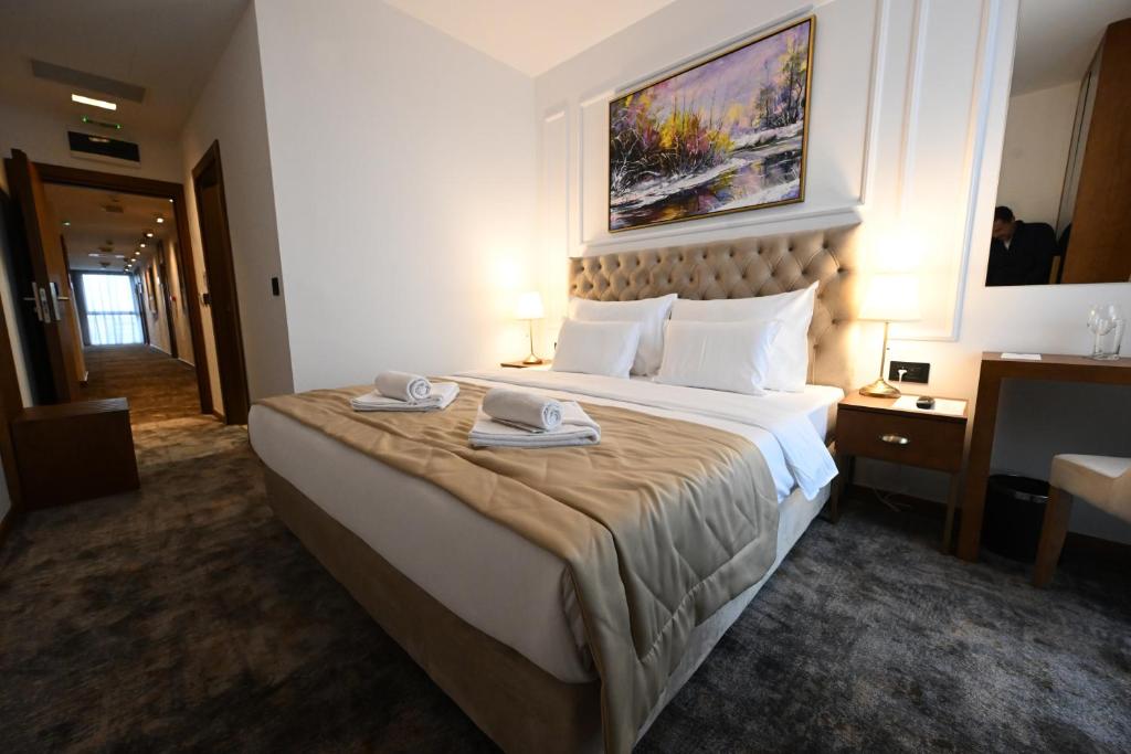 Postel nebo postele na pokoji v ubytování Hotel Tamiš & Spa