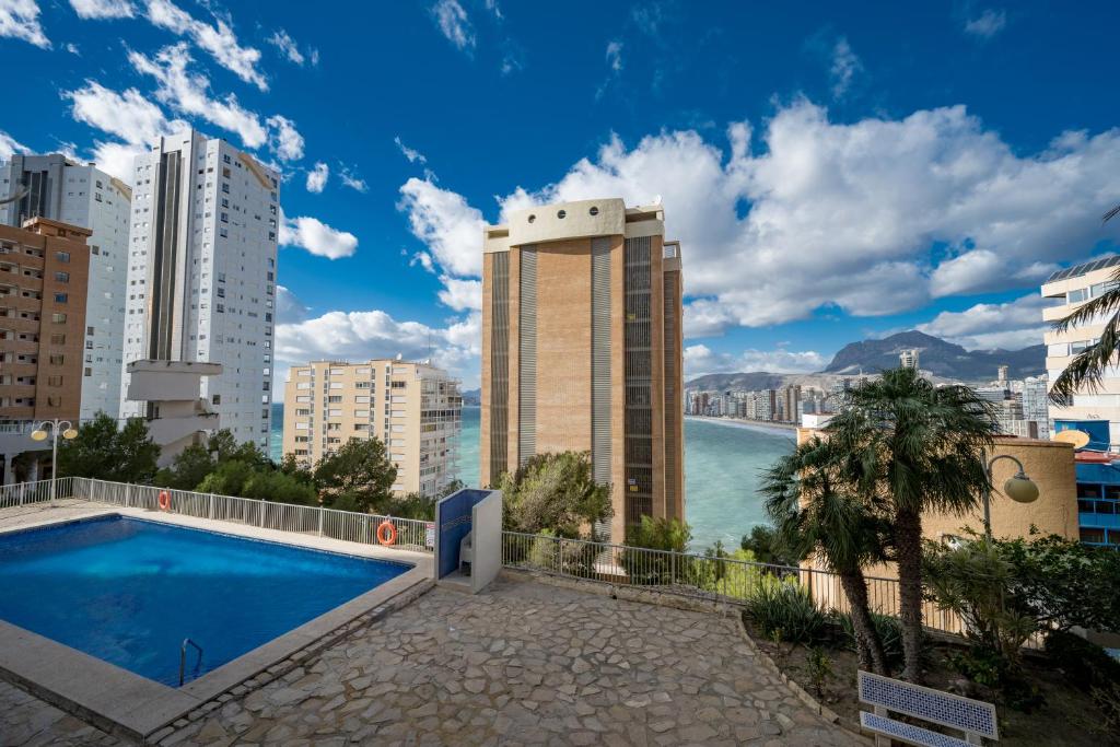 a view of a city skyline with a swimming pool at Beautiful 2 bedrooms Apartment in Agua Mundo in Benidorm