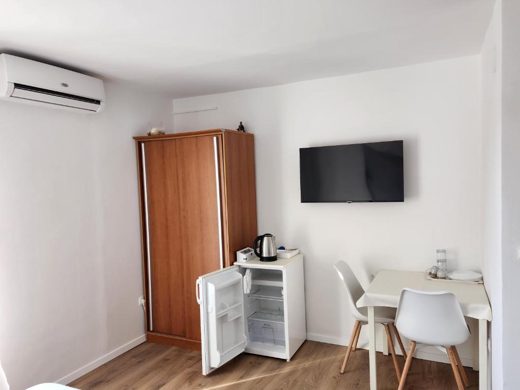 Kuchyň nebo kuchyňský kout v ubytování Apartmani Neva Supetar