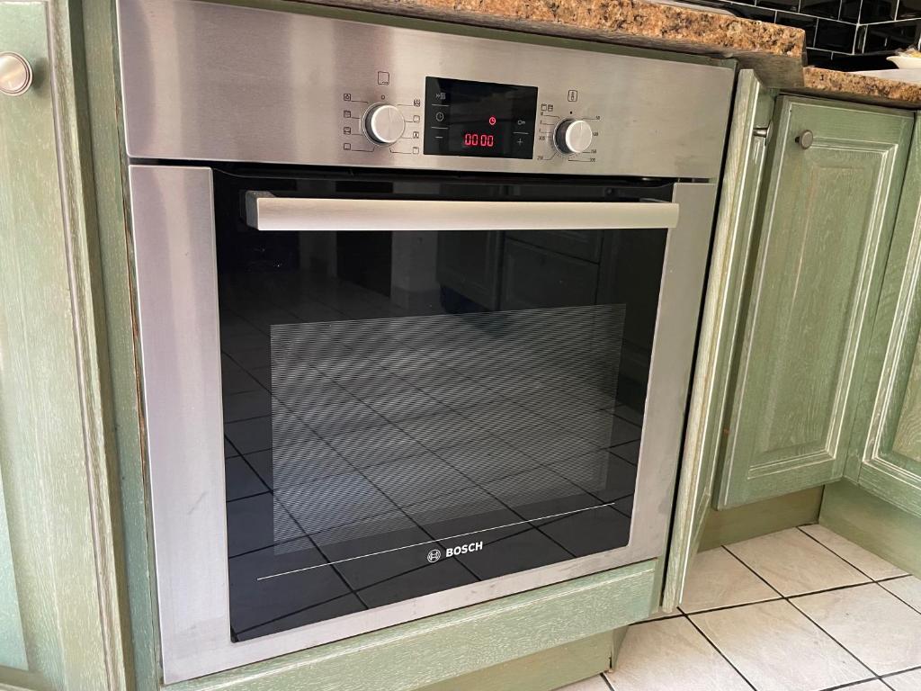 Kuchyň nebo kuchyňský kout v ubytování Maison de Jardin - Confort, commodité, bien équipé