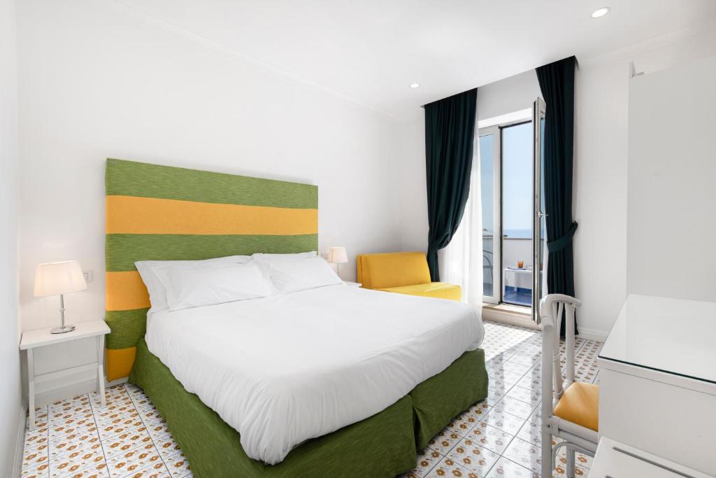 Postel nebo postele na pokoji v ubytování Hotel Bougainville
