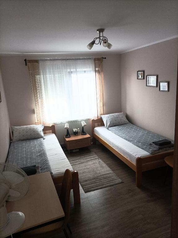 Postel nebo postele na pokoji v ubytování ARIANA apartman