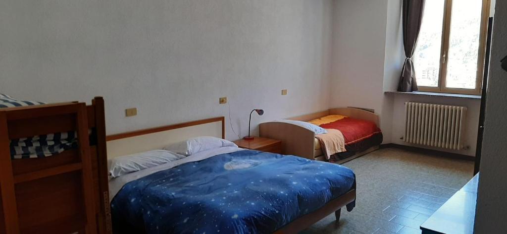 Postel nebo postele na pokoji v ubytování Ostello Al Deserto