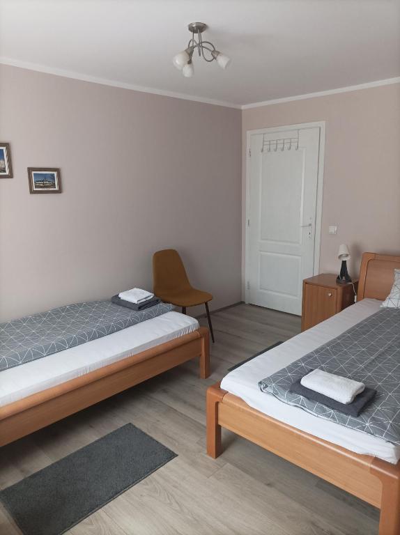 Postel nebo postele na pokoji v ubytování ARIANA apartman