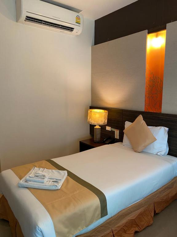 Postel nebo postele na pokoji v ubytování Al's Resort