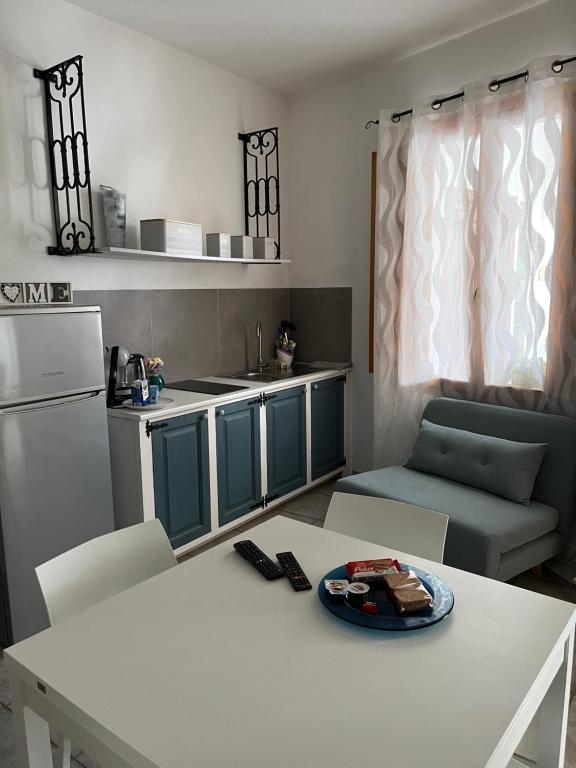 Kuchyň nebo kuchyňský kout v ubytování B&B Roseddu
