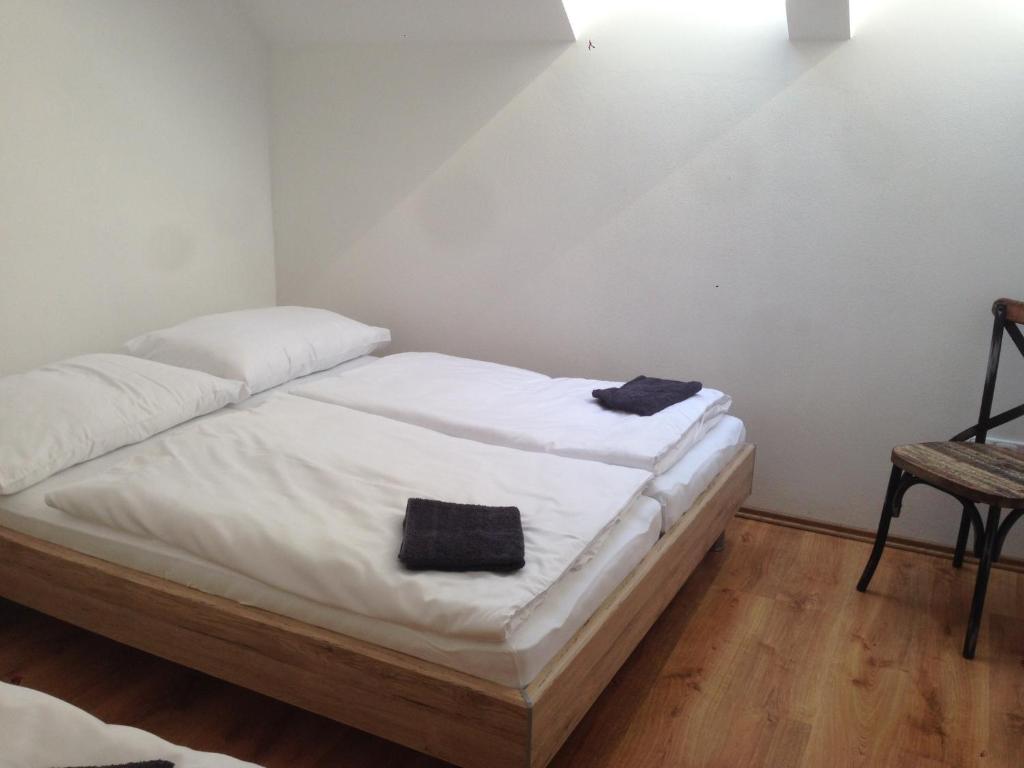 Postel nebo postele na pokoji v ubytování Vinařský apartmán Simenon