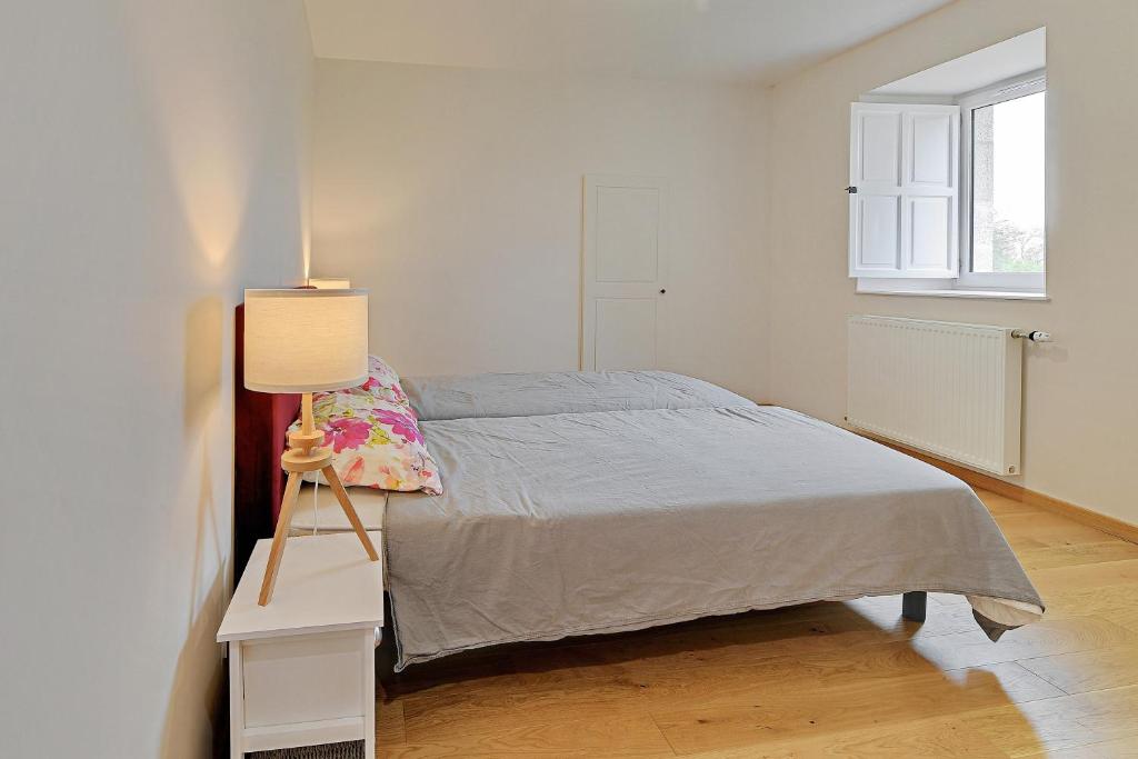 Łóżko lub łóżka w pokoju w obiekcie Petit Marigny - Belle maison pour 10 voyageurs