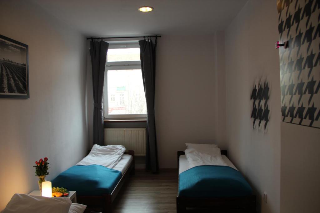 Posteľ alebo postele v izbe v ubytovaní Baba Hostel