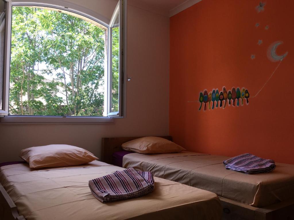 Łóżko lub łóżka w pokoju w obiekcie Charmante villa en Petite Camargue