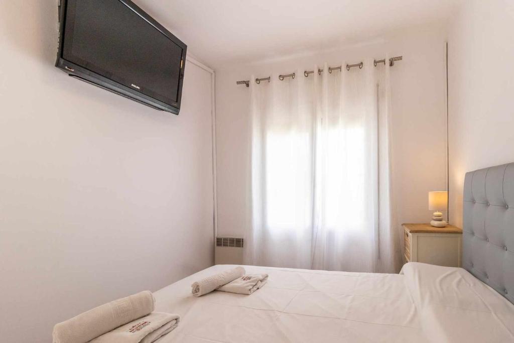 Posteľ alebo postele v izbe v ubytovaní Les Algues Encantador apartamento en el centro