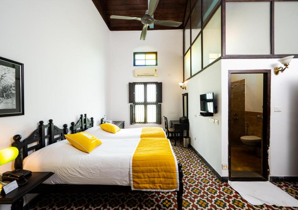 Llit o llits en una habitació de Bloom Boutique Waterfront Fort Kochi