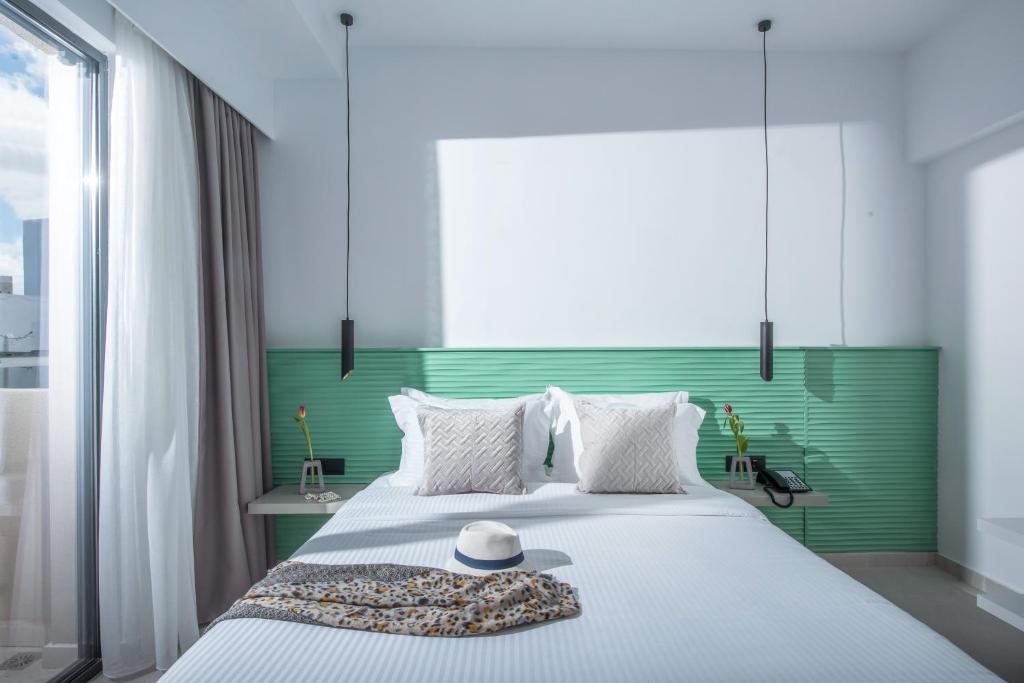 Postel nebo postele na pokoji v ubytování Meramaglia Hotel