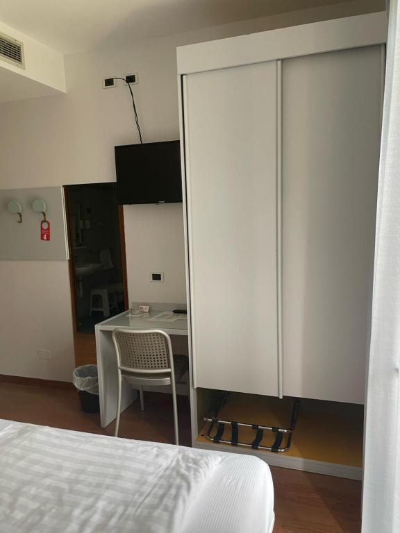 Postel nebo postele na pokoji v ubytování Hotel Al Caval