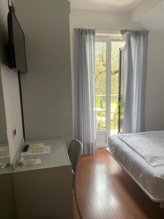Postel nebo postele na pokoji v ubytování Hotel Al Caval