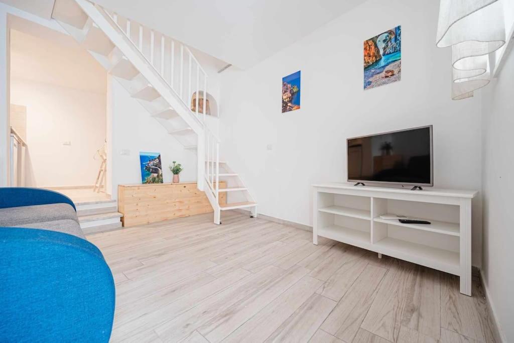A television and/or entertainment centre at White Amalfi Centro Storico by ItalianHost