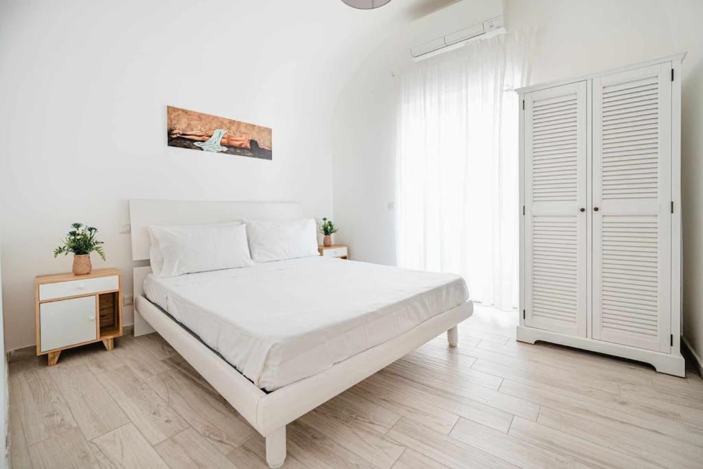 A bed or beds in a room at White Amalfi Centro Storico by ItalianHost