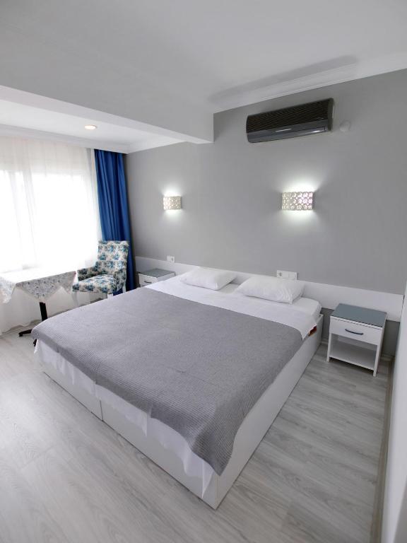 Postel nebo postele na pokoji v ubytování Artunc Hotel Bodrum