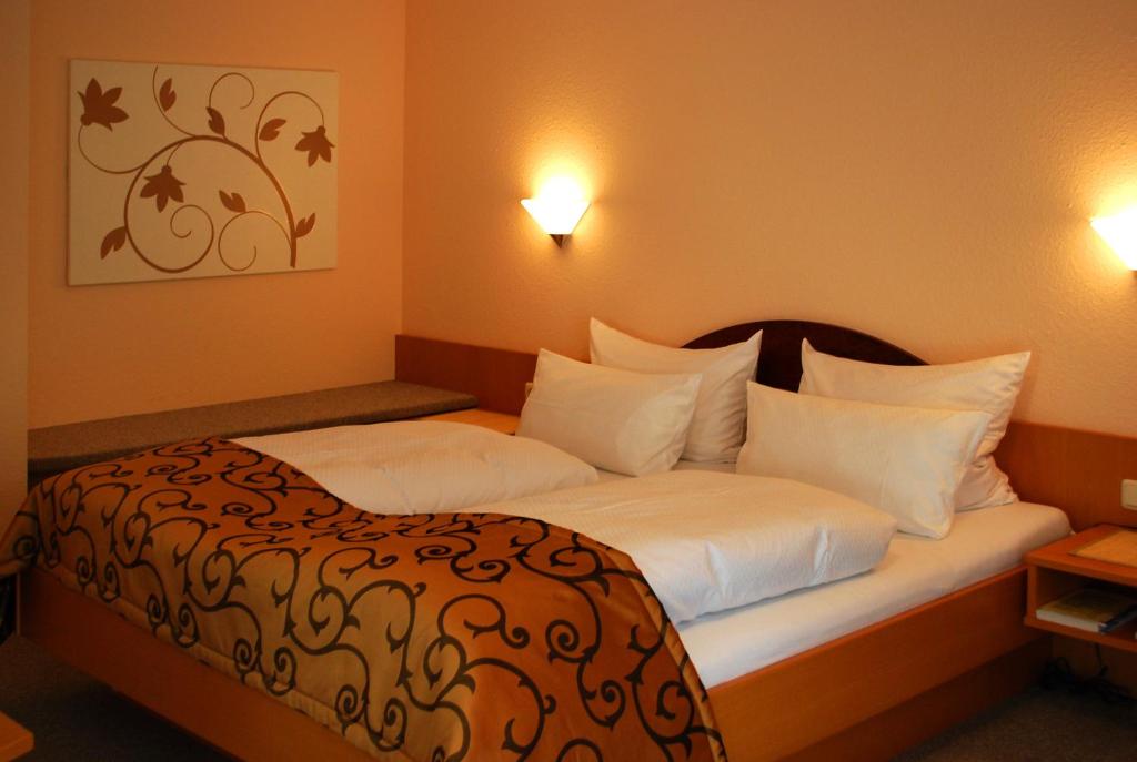 Postel nebo postele na pokoji v ubytování Im Winkel Appartements und Zimmer