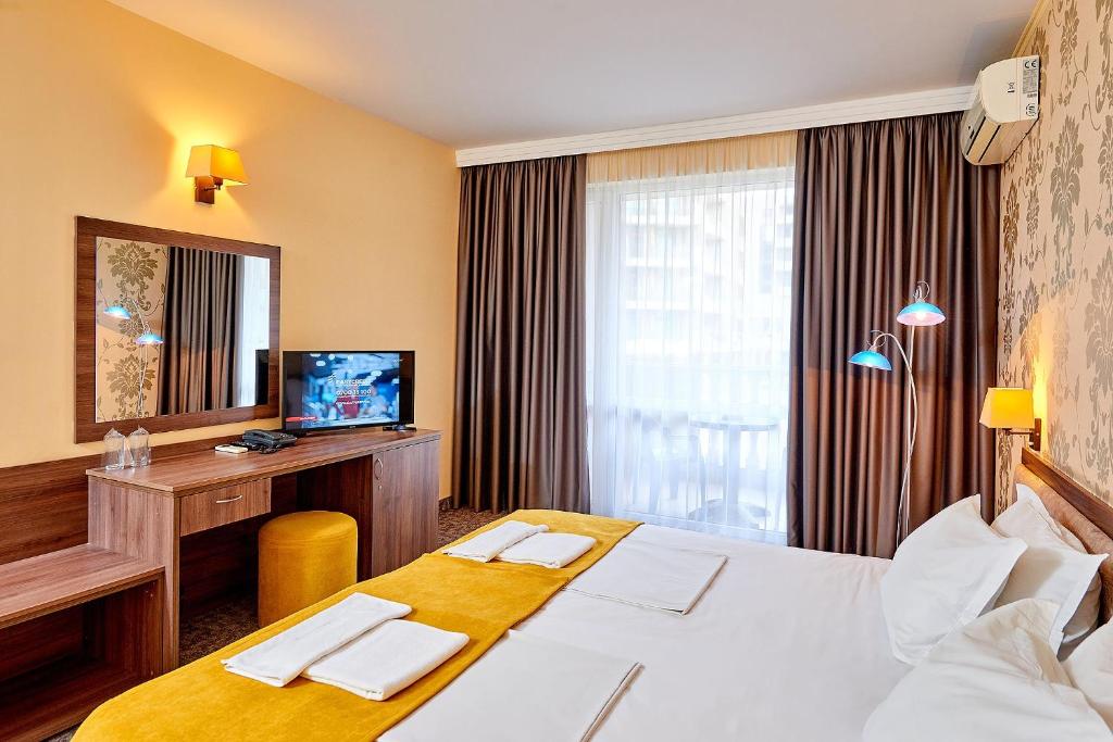 Postel nebo postele na pokoji v ubytování Sunny Beach Hotel Forum - All Inclusive