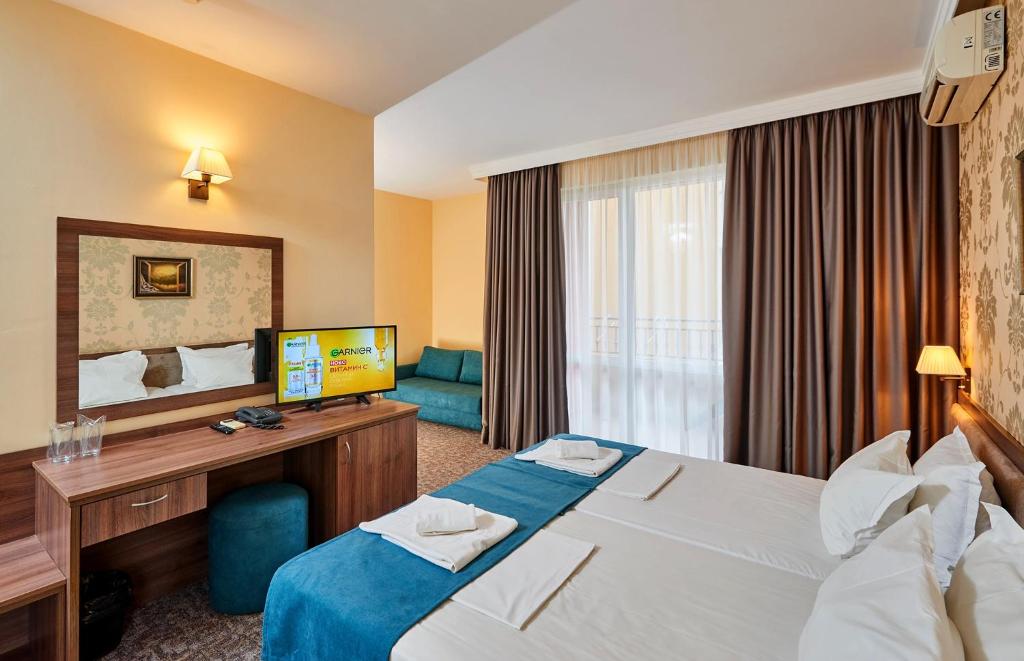 Postel nebo postele na pokoji v ubytování Sunny Beach Hotel Forum - All Inclusive
