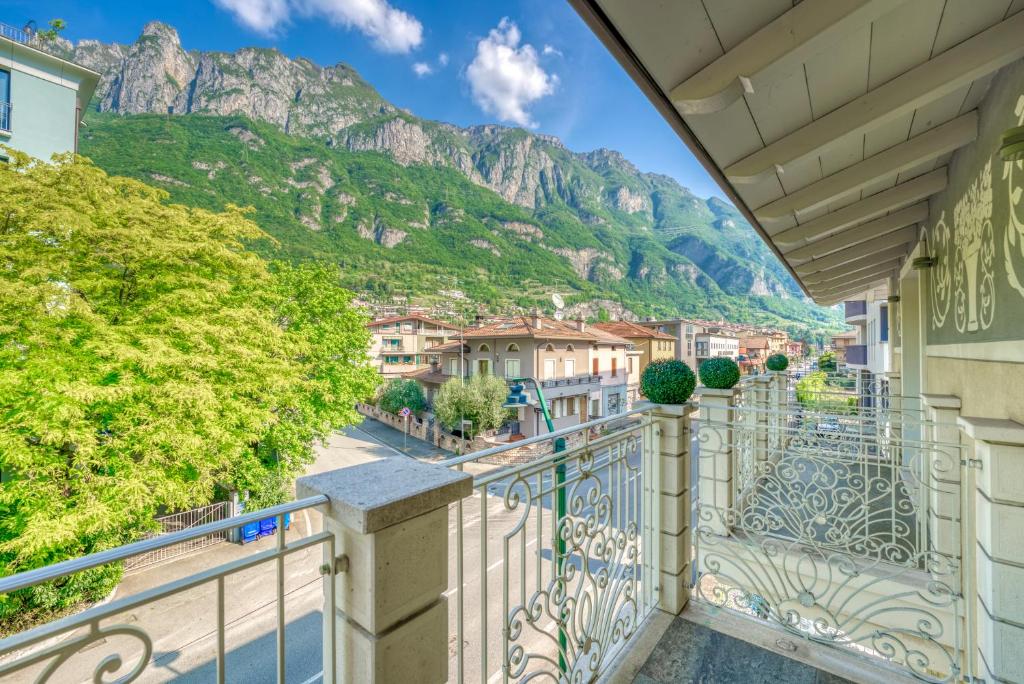 a balcony with a view of the mountains at Villa Liberty in Boario Terme
