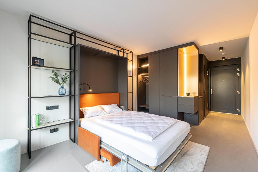 Postel nebo postele na pokoji v ubytování YUMA Apartments Leipzig Berliner Straße