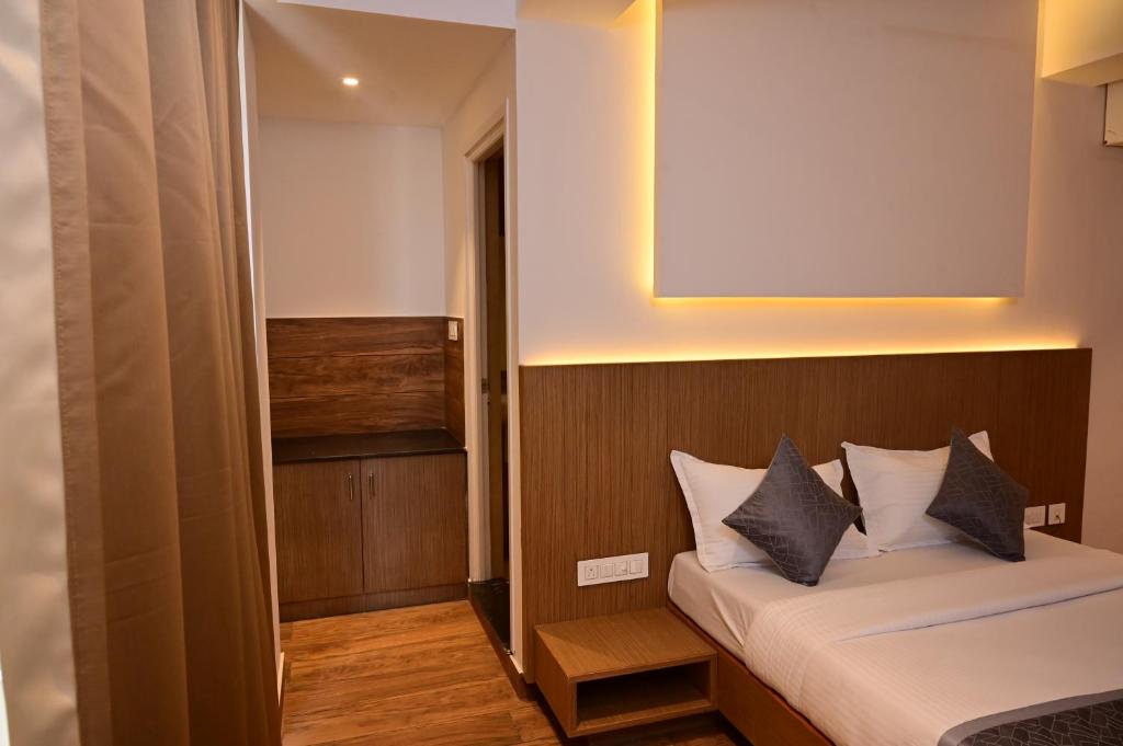 Postel nebo postele na pokoji v ubytování GRAND ONE TOWER