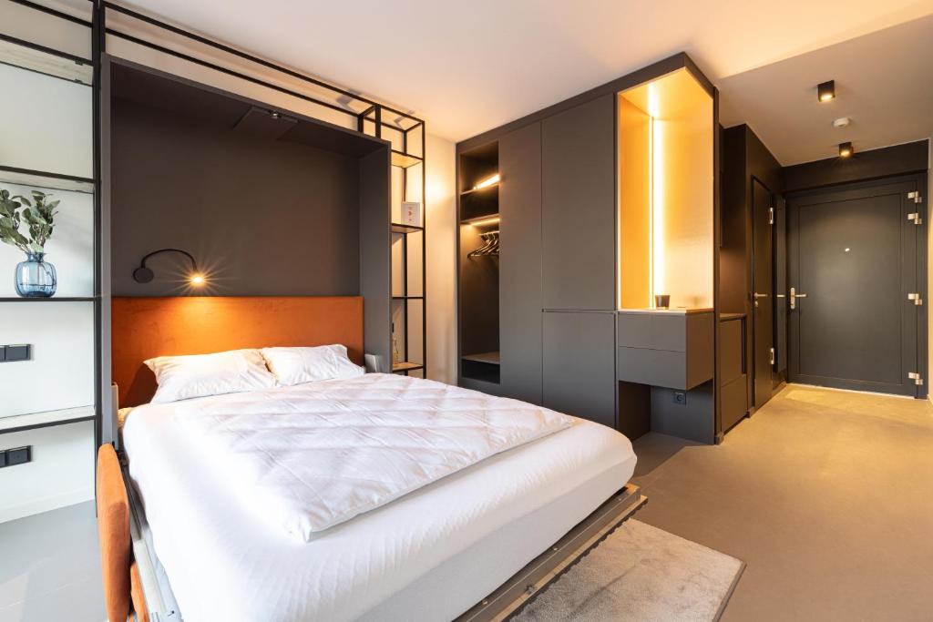 Postel nebo postele na pokoji v ubytování YUMA Apartments Leipzig Berliner Straße