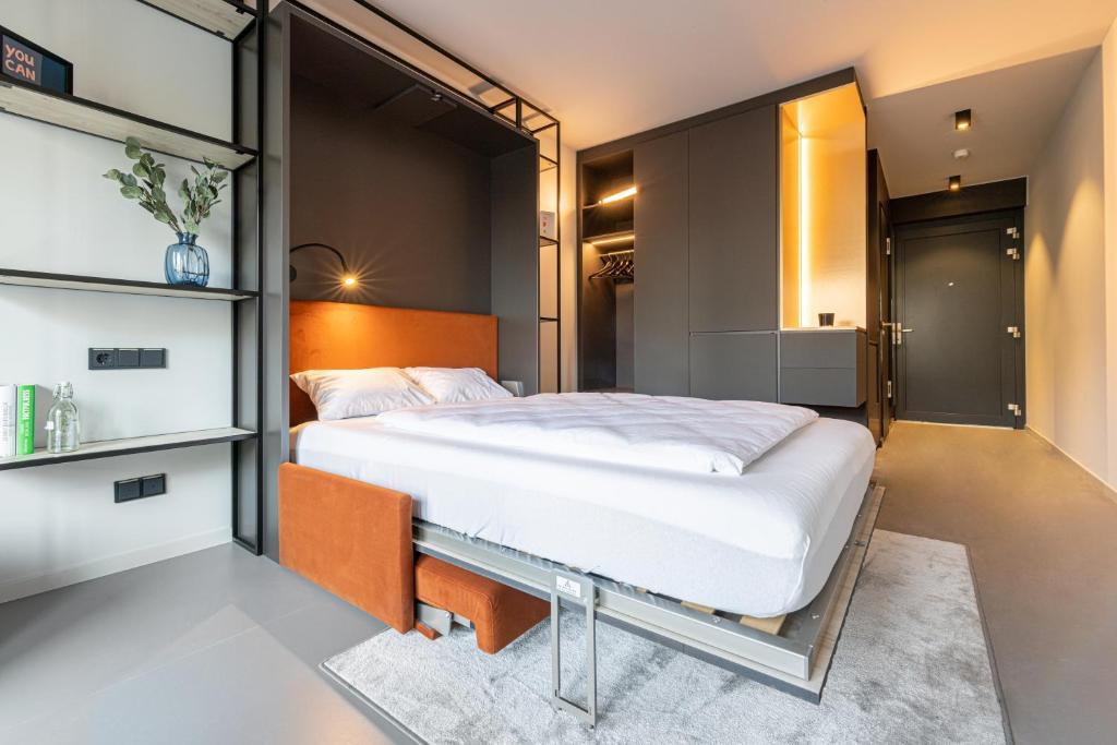 Postel nebo postele na pokoji v ubytování YUMA Apartments Leipzig Berliner Straße