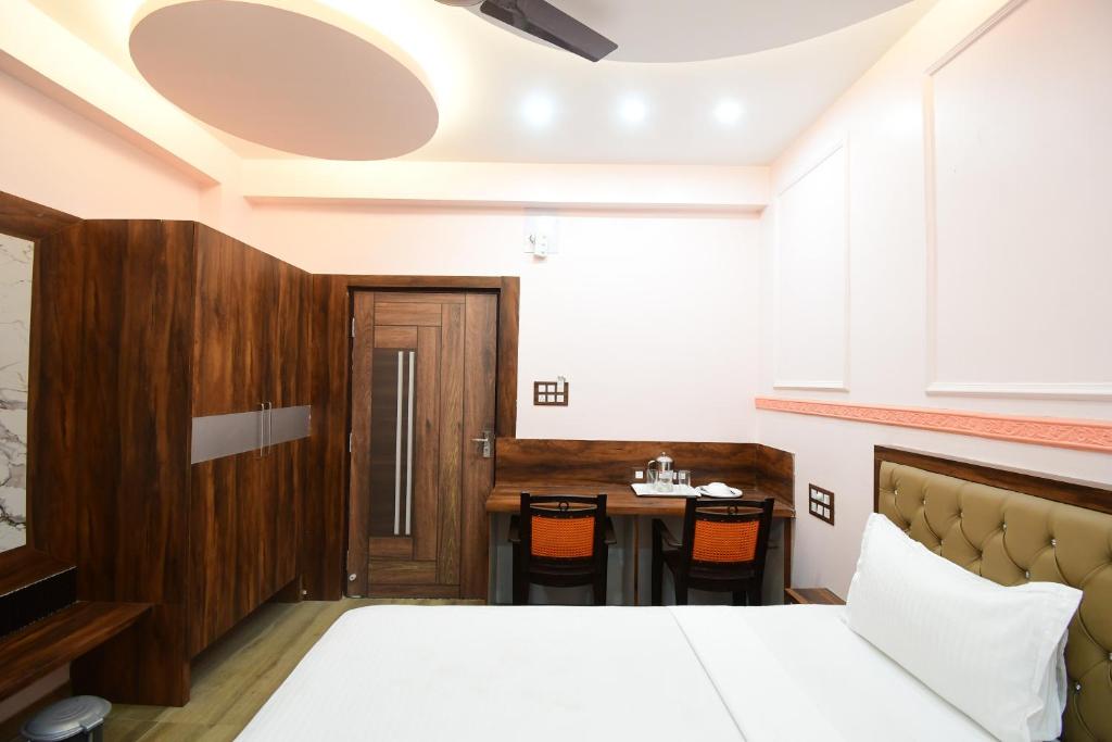 Postel nebo postele na pokoji v ubytování HOTEL SUSHREE INTERNATIONAL