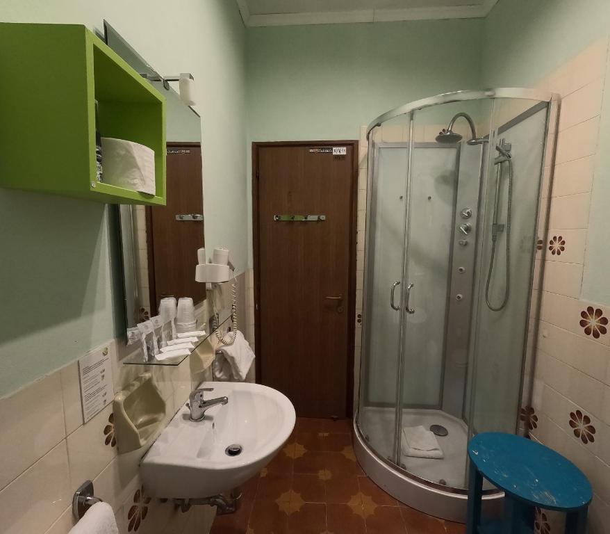 a bathroom with a shower and a sink and a toilet at Roma Room Hotel in Rome