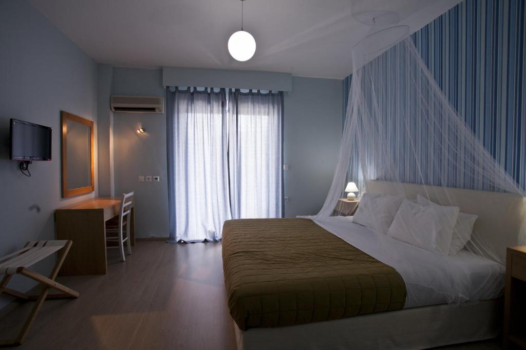 Postel nebo postele na pokoji v ubytování Valente Perlia Rooms