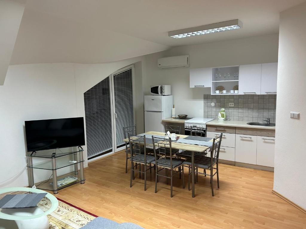Kuchyň nebo kuchyňský kout v ubytování Kondé Apartments A
