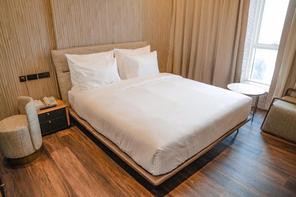 Postel nebo postele na pokoji v ubytování M14 Hotel Apartment