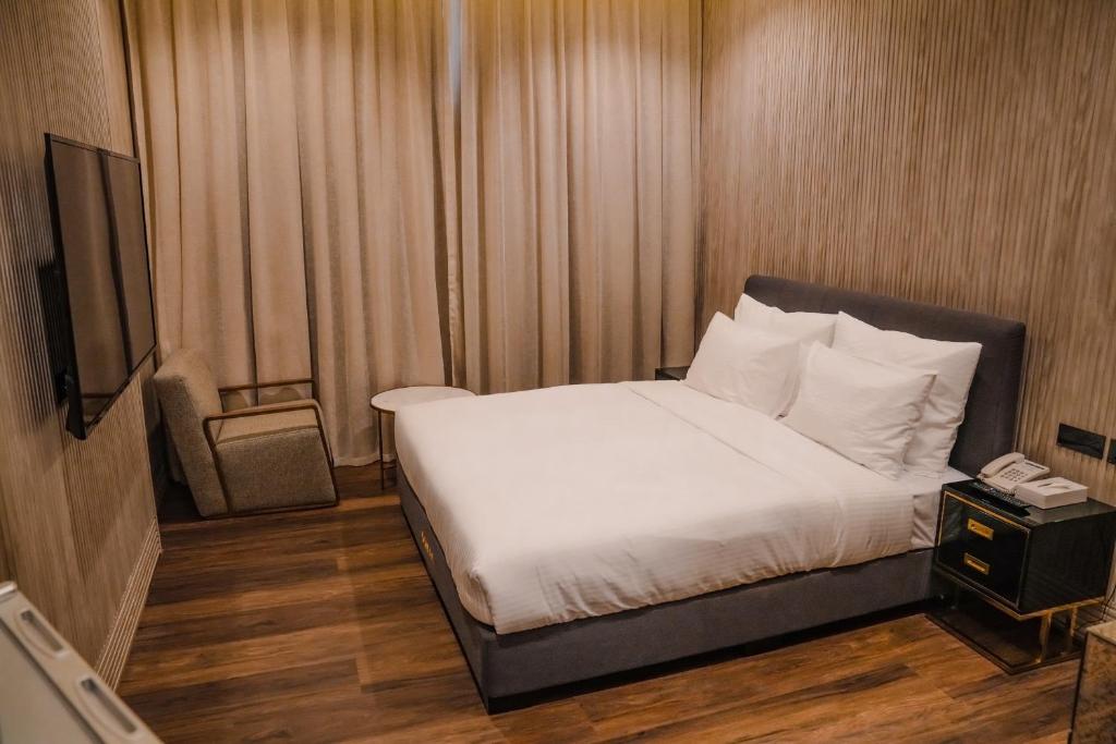Postel nebo postele na pokoji v ubytování M14 Hotel Apartment