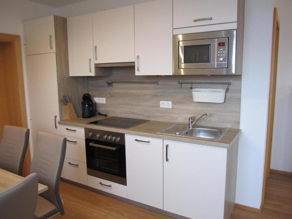 Kuchyň nebo kuchyňský kout v ubytování Ferienwohnung Oberkreut