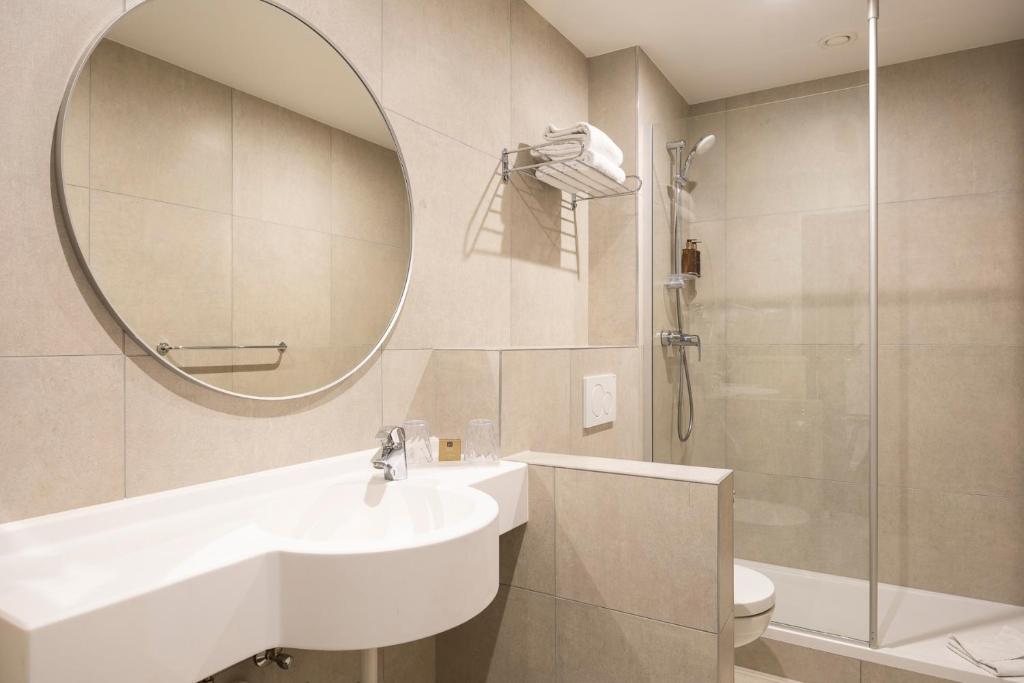 Koupelna v ubytování Aris Grand Place Hotel