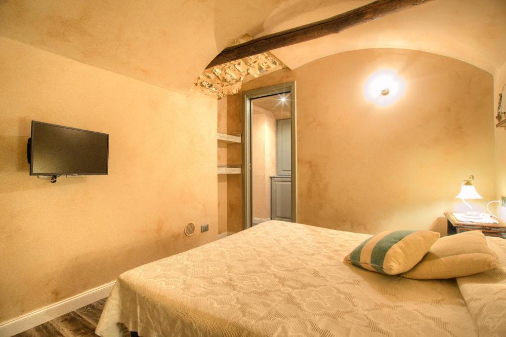 Postel nebo postele na pokoji v ubytování Casa Cannella con AC e wifi in borgo ligure